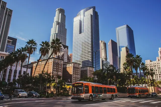 Downtown Los Angeles buildings and city traffic under a clear blue sky
