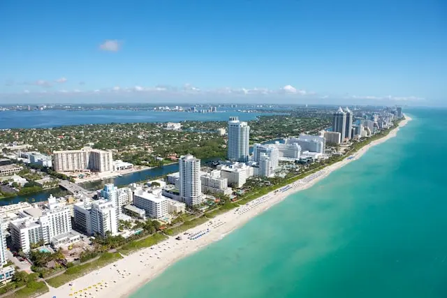 Aerial view of Miami Beach coastline with hotels and turquoise ocean
