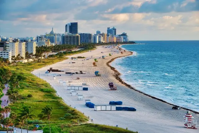 Miami Beach shoreline and city skyline with palm trees